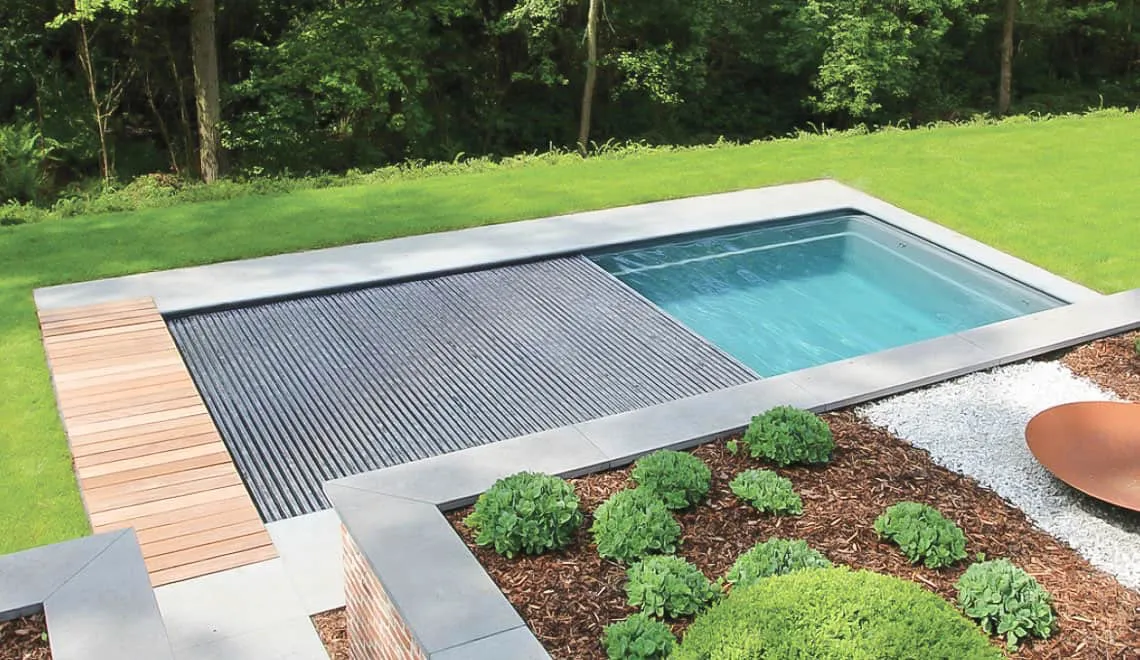 Leisure Pools Front Range shows a backyard pool that makes relaxing and taking care of your yard easy.
